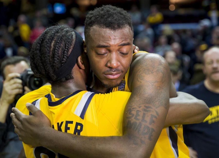 Kent State senior forward Jimmy Hall and sophomore guard Jaylin Walker embrace after beating Akron 70-65 in the MAC Title Game at Quicken Loans Arena in Cleveland, Ohio on Saturday. Walker was named MAC Tournament Most Valuable Player.