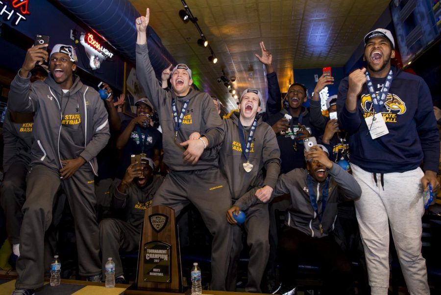 The Kent State men's basketball team reacts to their seeding in the NCAA Tournament at Water St. Tavern in Kent, Ohio, Sunday. Kent State played UCLA as a 14 seed in the South region in 2017.