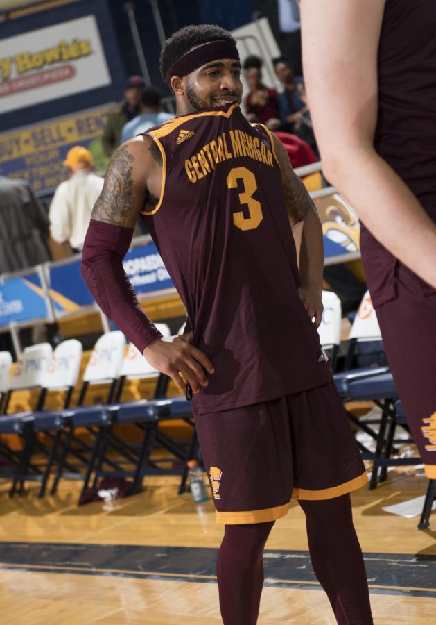 Central Michigan junior guard Marcus Keene bites his jersey while waiting to shake hands with Kent State after loosing in overtime 116-106 in the first round of the MAC Men's Basketball Tournament at the M.A.C. Center on Monday, March 6, 2017. Keene had a game high 41 points.