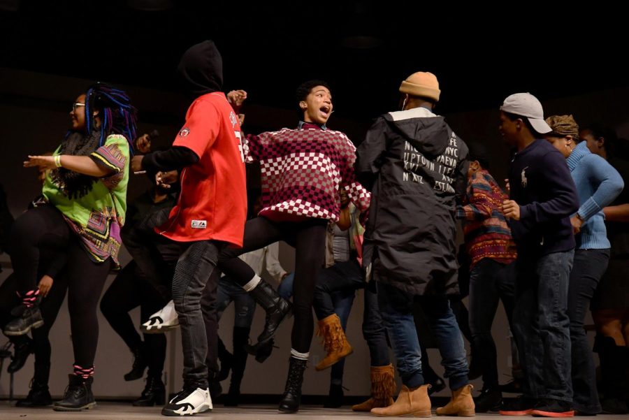 Members of the audience come on stage to dance during intermission during the Black Excellence Showcase at the Michael Swartz Center Auditorium on Thursday, March 2, 2017.