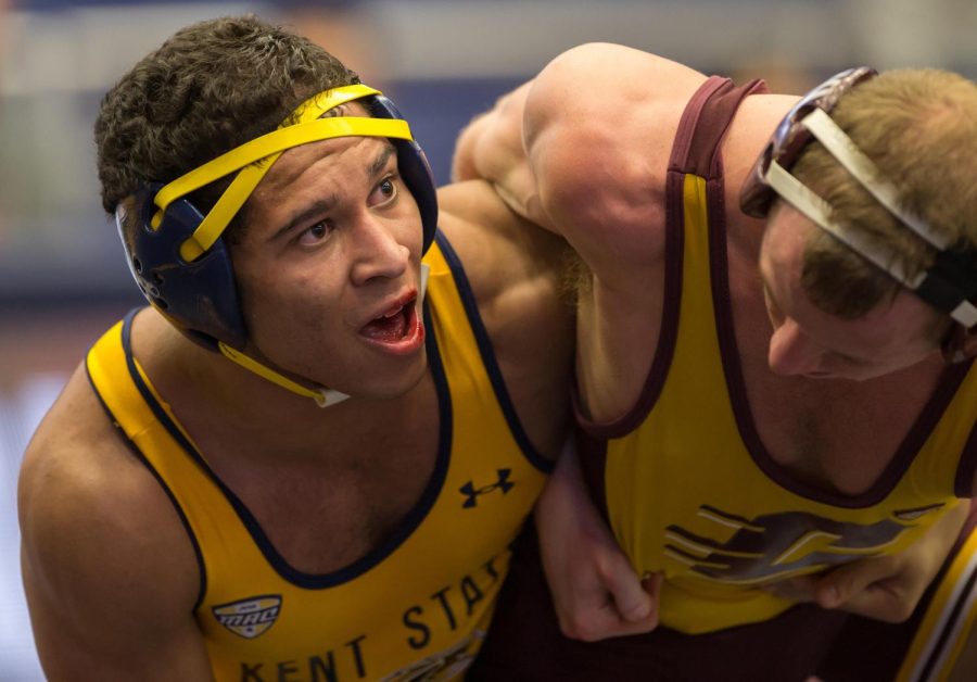 Redshirt freshman Casey Sparkman looks toward the clock during his match against Justin Oliver of CMU in the MACC on Sunday, Feb. 14, 2016. Sparkman won 4-2. Kent beat CMU 18-17.