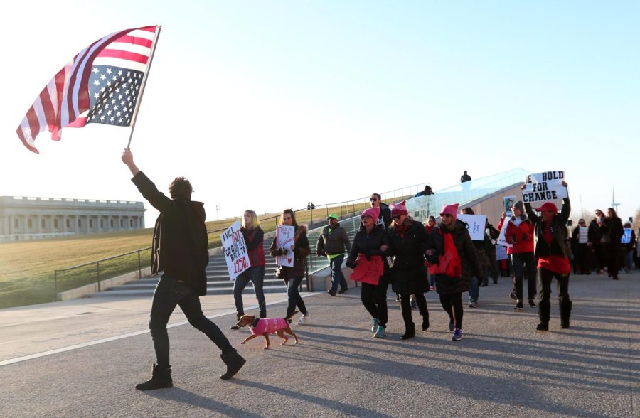 Former Kent State student Martins Krebs walks with the women of the International Women’s Day March in Cleveland, Ohio, on Wednesday, March 8, 2017. Krebs helped organize the march that met at Willard Park.