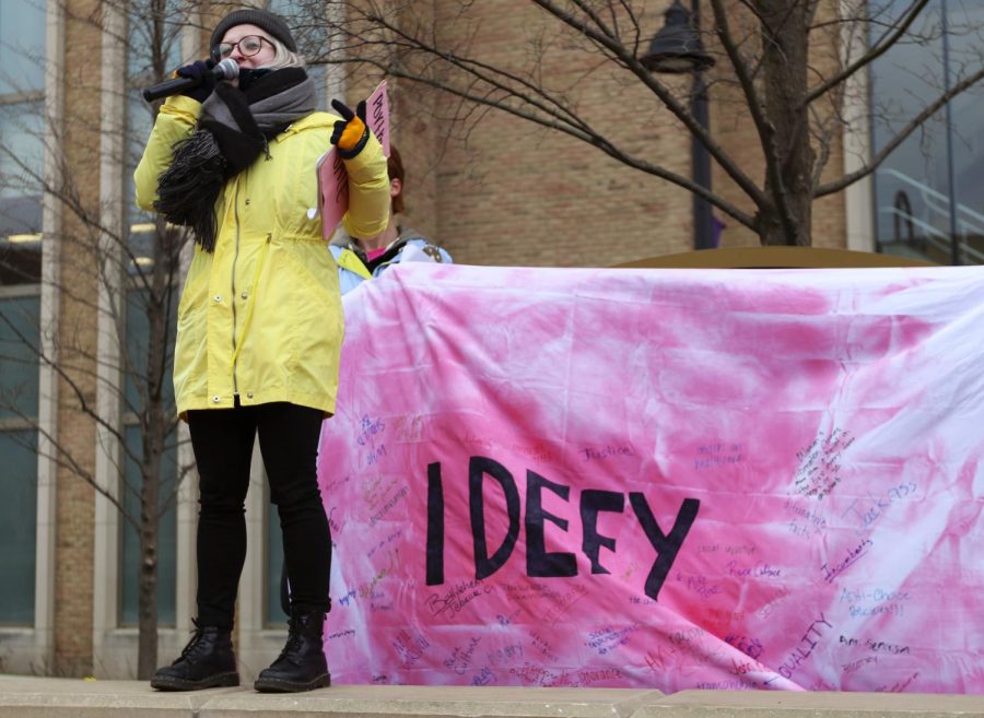 Kent State political science and history sophomore Maddie Newingham speaks during the “I Defy” demonstration hosted by the Planned Parenthood Advocates of Kent State in Risman Plaza on Thursday, April 6, 2017. “Not many people know this but one in five students on Kent State’s campus are sexually assaulted and this is why Planned Parenthood was so important to me,” said Newingham.