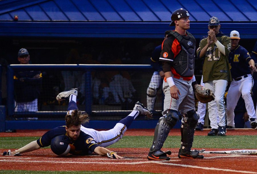 Kent State redshirt junior outfielder Nick Kanavas, slides into home plate to score the first run of the game against Bowling Green in the bottom of the 7th inning at Schoonover Stadium on Tuesday, April 25, 2017. 