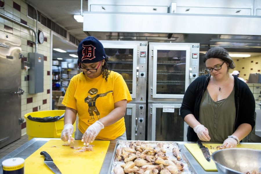 Torrie Sweeney and Alysha Allen volunteer at Campus Kitchen on Tuesday, April 11, 2017.