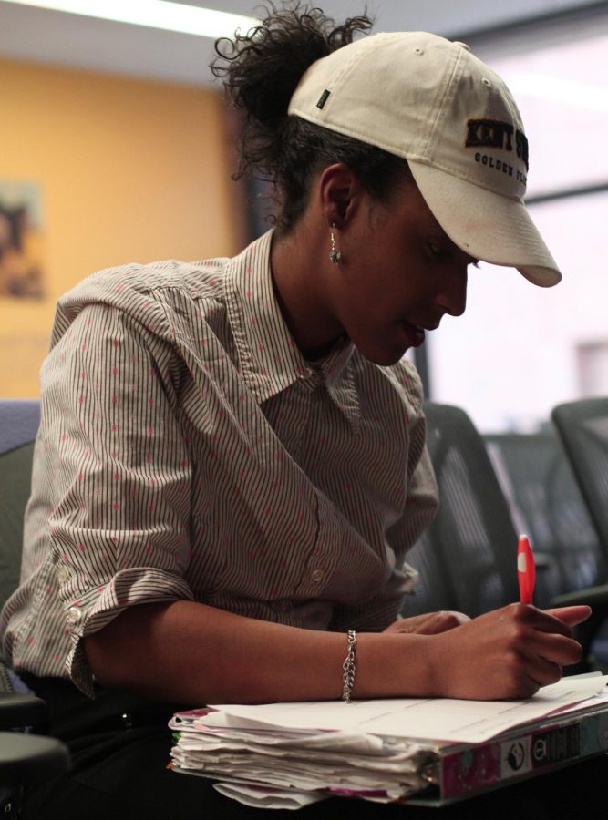 Theatre performance student, Dara Sherman, takes notes at a workshop in the multicultural center on April 4, 2017. KSU SNAPP club’s workshop benefits Sherman for her minor in event planning and tourism management.