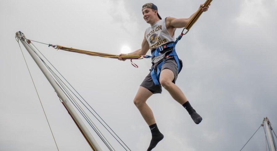 Kent State freshman construction management major Chandler Hildebrand bungees at FlashFest 2017 on Thursday, April 20, 2017, on the Student Green.