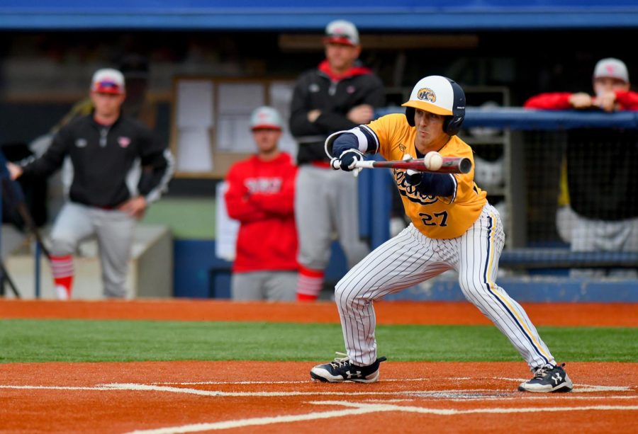 Kent State redshirt senior outfielder Luke Burch attempts to bunt the ball in against Youngstown State on Tuesday April 4, 2017. Kent would go on to lose 11-6 to Youngstown. 