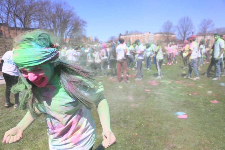 Participants of the Holi "festival of colors" event cover each other in powdered color on Manchester Field on Saturday, April 8, 2017.