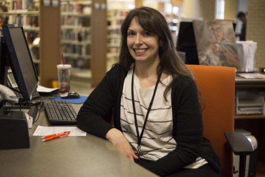 Melissa Ziminsky, Adult Services Director of the Kent Free Library, poses at her desk in on Tuesday, March 25, 2017.