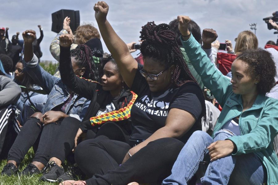 Members of Kent State's BUS show solidarity for Samaria Rice, keynote speaker of the 46th annual May 4 commemoration ceremony, on the university's Commons on Wednesday, May 4, 2016. 