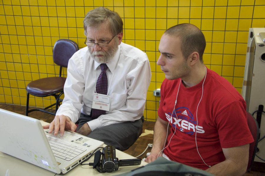 Gary Hanson helps student Jon Jankowski edit a video in 2013. 