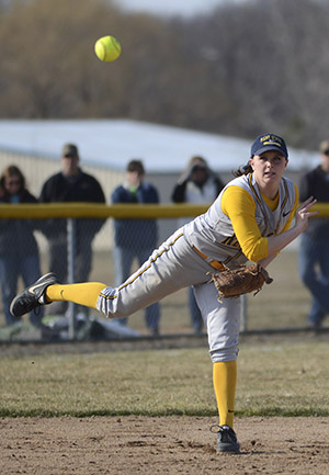 Kent State softball player Lauren Kesterson throws a ball to first base during a during a double header against University of Akron on Saturday, March 30, 2013. 