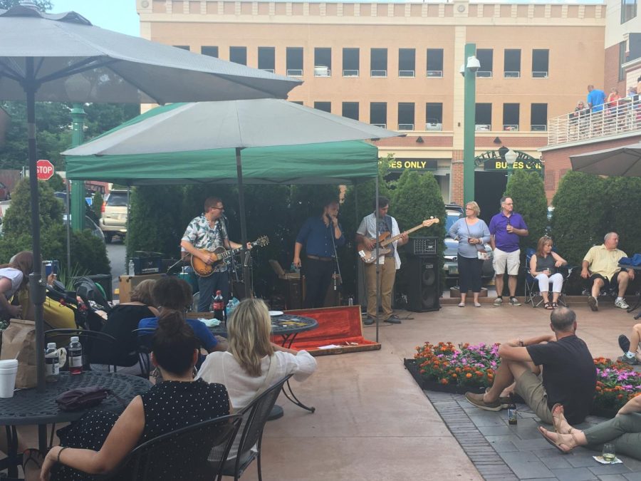 Blues fans gather outside to hear musicians play during the ninth annual Kent Blues Fest on Friday, July 14, 2017.