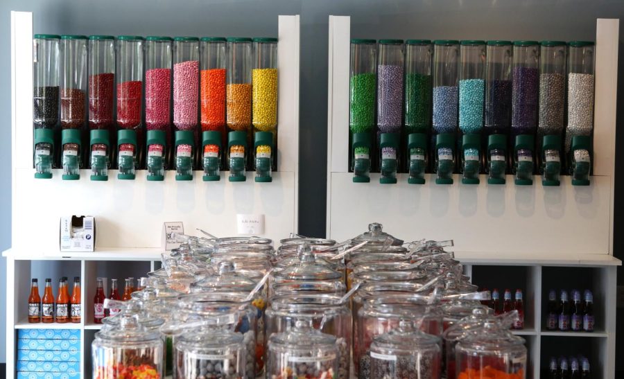 Brightly colored candies fill displays at Sugar Rush, a new candy shop in downtown Kent, on Friday, Aug.25, 2017.