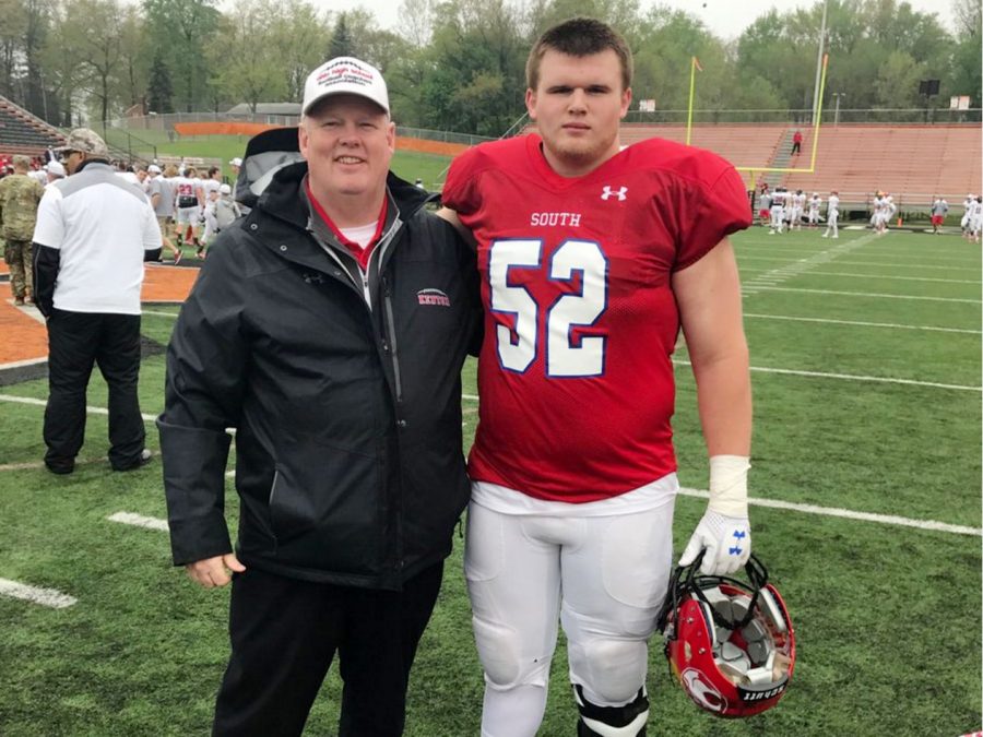 Tyler Heintz, right, died after a morning workout with the Kent State football team June 13. Heat was likely a factor in the death, according to the Portage County coroner.