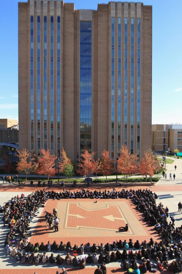 Students, faculty and staff participate in a walkout Thursday, Nov. 10, 2016, in response to Donald Trump’s election day victory becoming the 45th president of the United States.