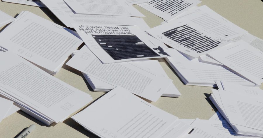 Examples of black-out poetry sit on a table for an activity hosted by the Wick Poetry during the Kent Creativity Festival in downtown Kent on Saturday, Sept, 30, 2017.