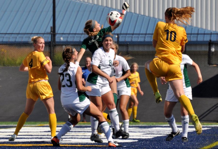 Kent players battle for the ball after a corner kick during a game against EMU on Sunday, Sept. 24, 2017.