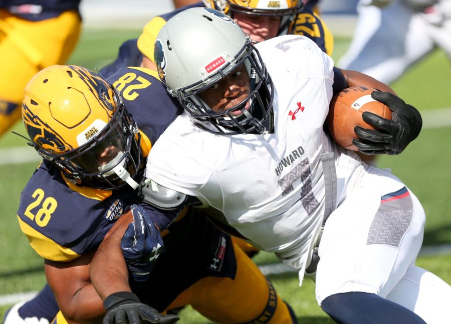 Kent State safety Manny Lawrence-Burke tackles Howard running back Anthony Philyaw.