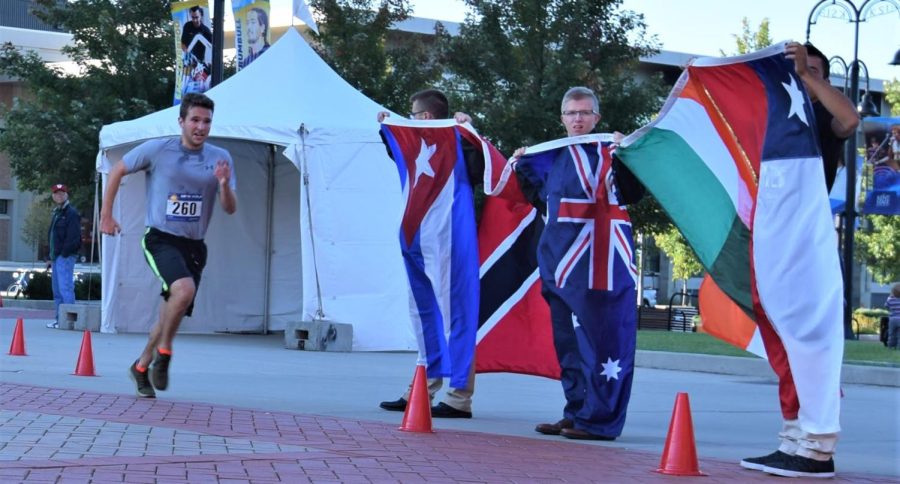 Zach Morris sprints the last few feet to cross the finish line and conclude his “voyage around the world,” achieving third place with a time of 18:01.