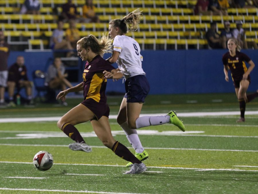 Freshman forward Isabelle Mihail races Central Michigan defender Ally Viazanko for the ball during a game on Friday, Sept. 22, 2017.