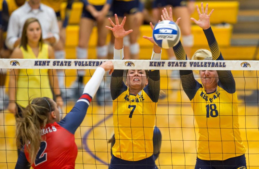 Seniors Katarina Kojic and Drew Norberg block a hit by RMU at the M.A.C. Center on Sept. 6, 2016.