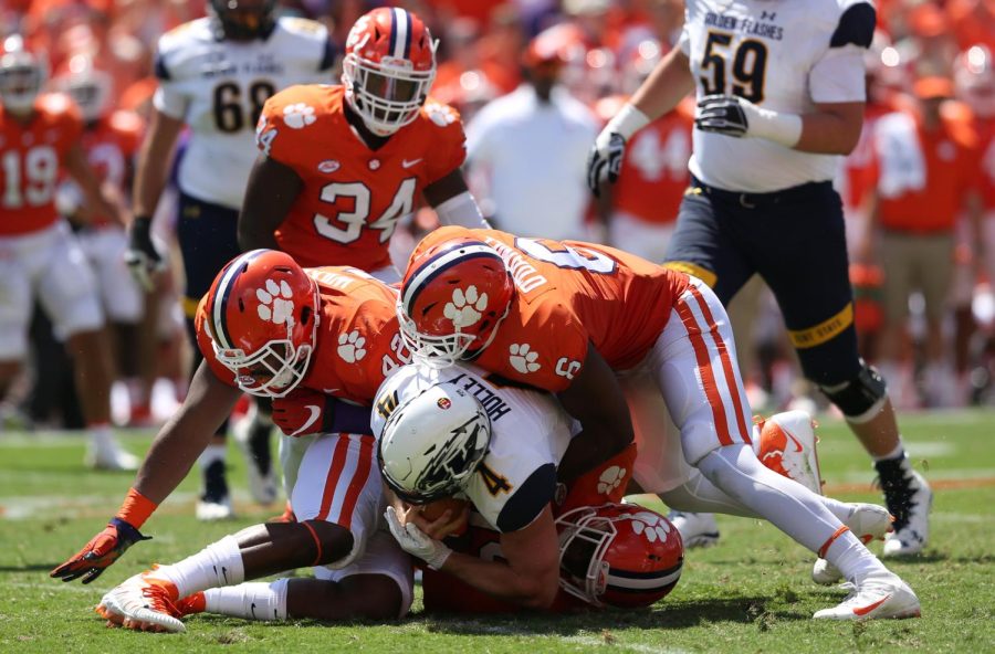 Clemson players surround Kent State quarterback Nick Holley during the first half of Kent State's matchup against No. 5 Clemson.