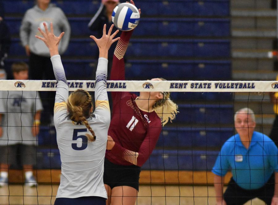 Kent State opposite Amy Kober goes up for the block against Charleston on Sunday, Sept. 10, 2017.