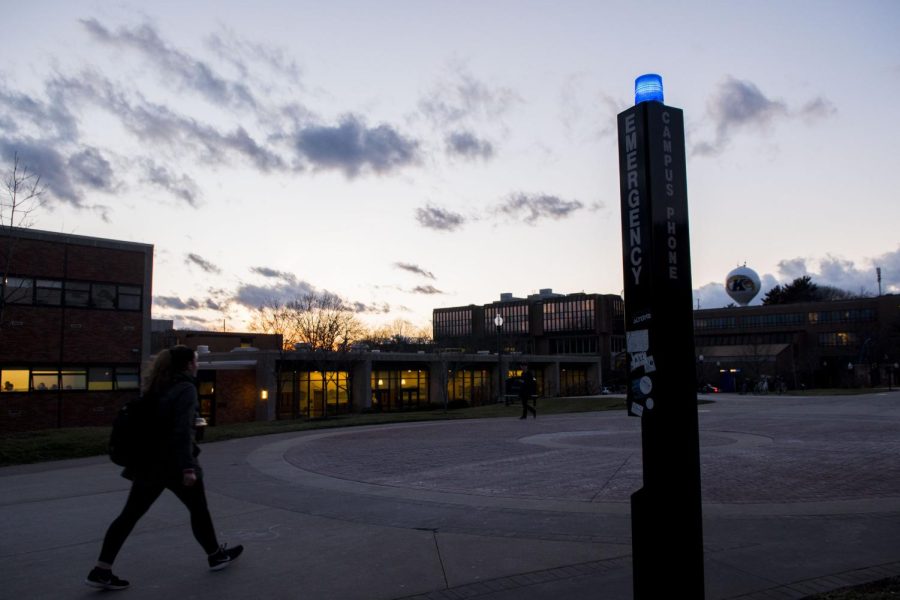 A student walks by a campus emergency phone in front of Olson Hall on Tuesday, Feb. 14, 2017. 