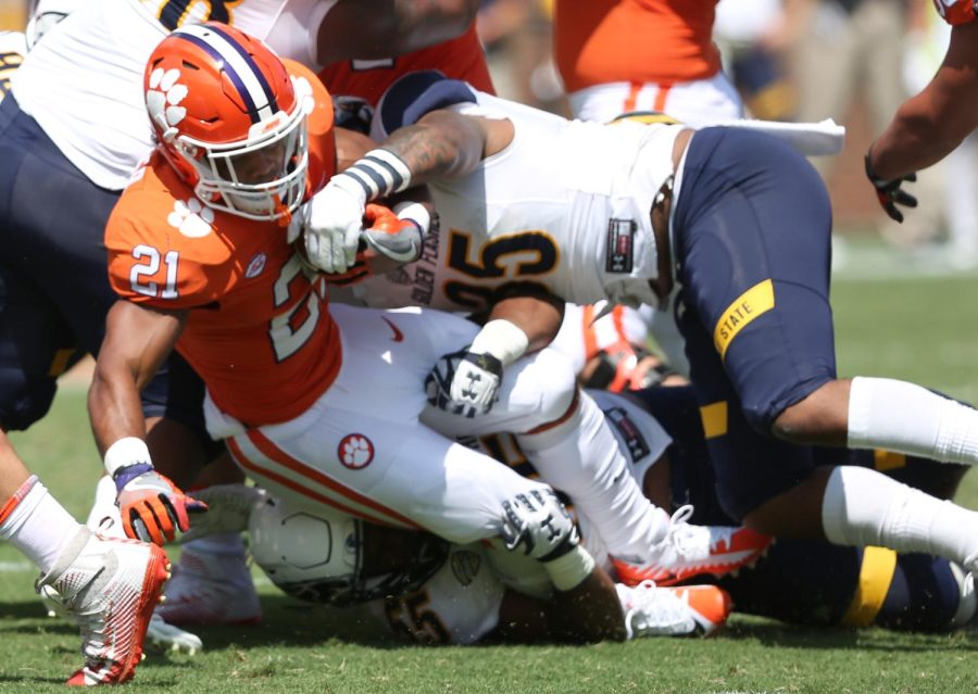 Clemson's Darlin Rencher takes drives through the line for a short gain in the second half.