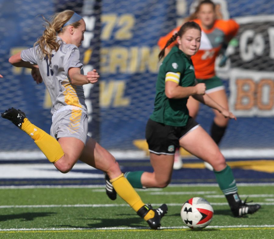 Kent State senior forward and midfielder Donavan Capehart takes a shot on goal against Ohio Thursday, Oct. 26, 2017.