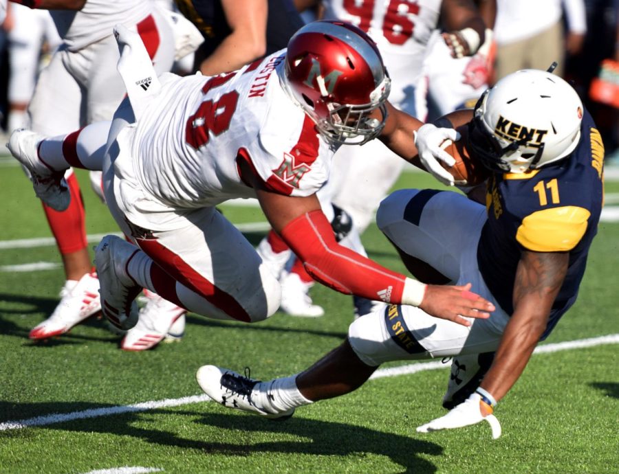 Running back Justin Rankin gets tackled during the second quarter against Miami (OH) Saturday, Oct. 14, 2017.