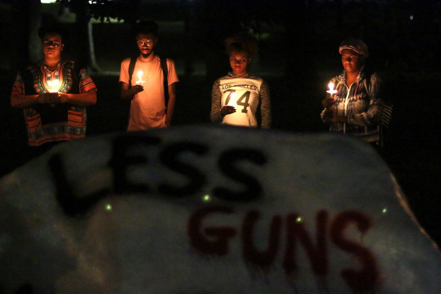 Students from Kent State come together at the Rock on Sunday, Oct. 1, 2017, to mourn and pray over a shooter attacked a country concert in Las Vegas earlier this week.