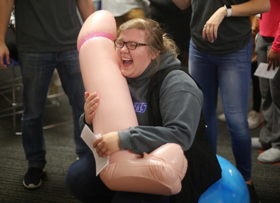 Katie Studnicha, a junior visual communication design major, plays “Dick Jousting” during Sextoberfest Friday, Oct. 27, 2017.