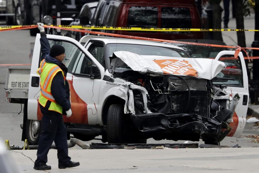 A damaged Home Depot truck remains on the scene Wednesday, Nov. 1, 2017, after the driver mowed down people on a riverfront bike path near the World Trade Center on Tuesday in New York. (AP Photo/Mark Lennihan)