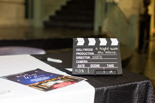 A clapboard sits on the table outside the auditorium in Hall. 