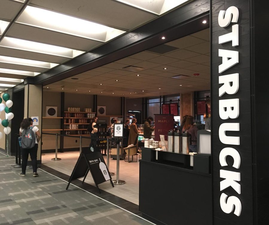 Students wait in line for their afternoon coffee at the new Starbucks located in the University Library Wednesday. 