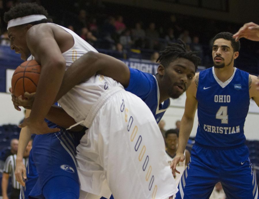 Kent State junior center Adonis De La Rosa attempts to steal the ball from Ohio Christian freshman center Genesis Williams in the second half of the game Thursday, Nov. 16, 2017.