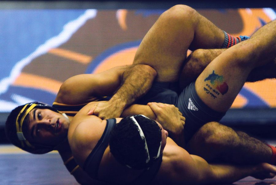 Kent State fifth-year student Stephen Suglio takes down Lake Erie College's Jesse Palser in a wrestling match Friday, Nov. 3, 2017 in the M.A.C. Center.