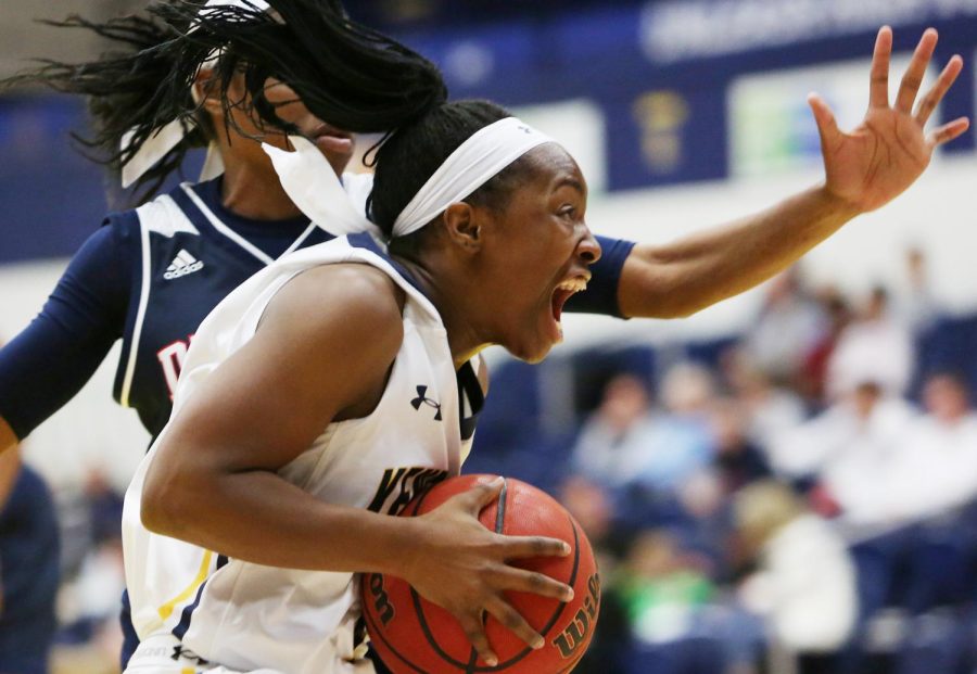 Kent State senior guard Naddiyah Cross drives to the basket against Detroit Mercy Thursday, Nov. 30, 2017.