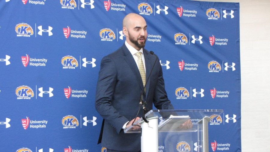 Sean Lewis, 31, speaks at the podium after being introduced as Kent State's 22nd head football coach in program history Thursday, Dec. 21, 2017. Lewis signed a five-year, $2.3 million contract with the university.