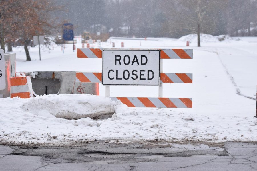 Road closed signs sit in snow on the old West Campus Center drive Monday Jan. 15, 2018. The change of West Campus Center is part of the current Summit Street project.