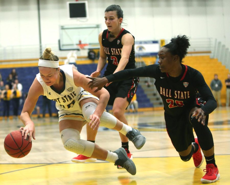 Kent State senior forward Jordan Korinek, Ball State junior guard Carmen Grande and senior guard Frannie Frazier battle for a loose ball Saturday, Jan. 20, 2018. Ball State went on to win, 79-58.