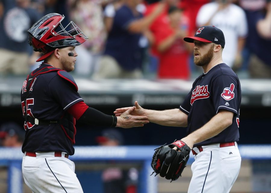 Cleveland Indians' Roberto Perez, left, and Cody Allen celebrate a 5-3 victory over the Detroit Tigers Wednesday, Sept. 13, 2017, in Cleveland. The Indians set the American League record with 21 consecutive wins.