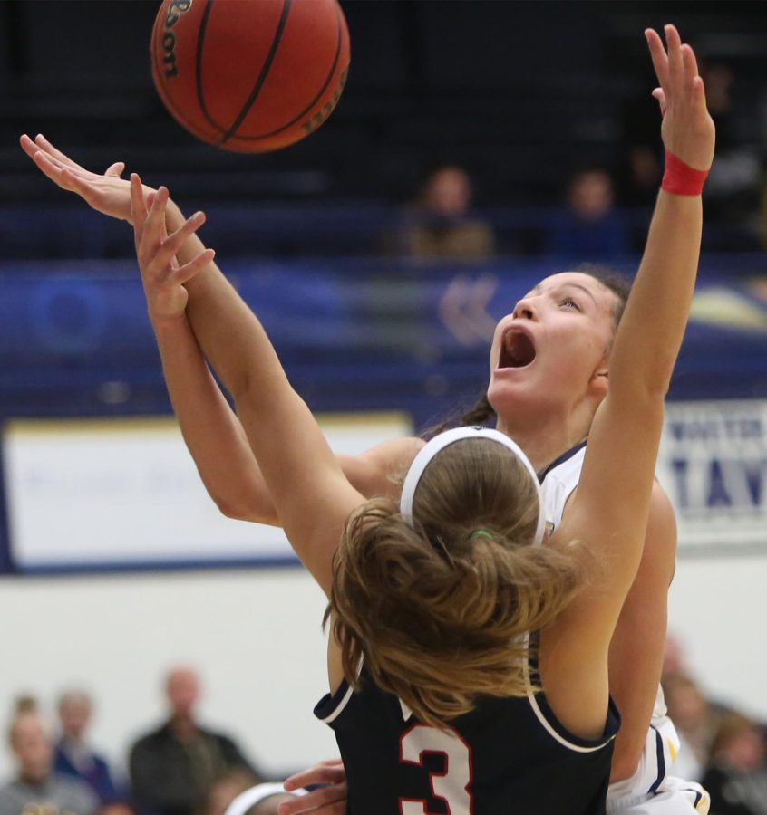 Kent State senior guard Alexa Golden is fouled on a drive to the basket against Detroit Mercy Thursday, Nov. 30, 2017. The Flashes won the game, 82-74. [FILE]