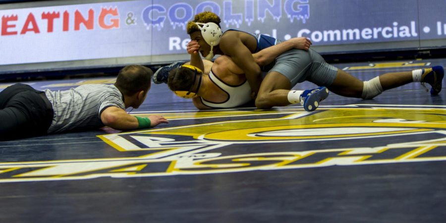 Freshman Jake Ferri grapples with an Old Dominion wrestler Wednesday, Feb. 9 at the M.A.C. Center. The Monarchs won the match, 19-14.