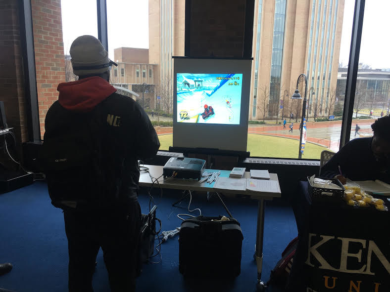 A student playing Mario Kart while wearing goggles that mimic intoxicated vision during Kent Police's distracted driving event on Thursday. 