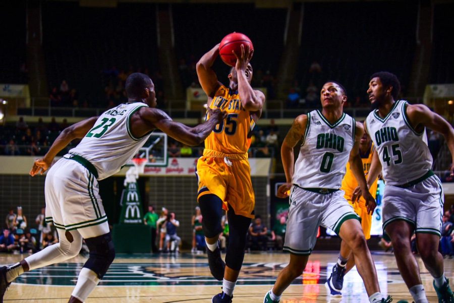 Kent State senior guard Kevin Zabo gets fouled driving to the basket during the Flashes' 88-76 loss to Ohio at the Convocation Center Feb. 20, 2018. 