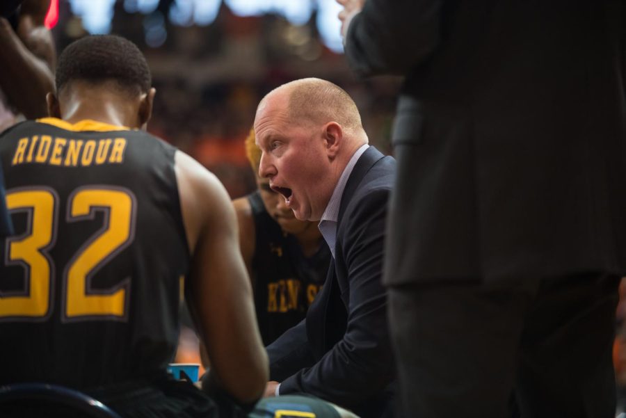 Coach Rob Senderoff gives instructions during a timeout during Kent State's 70-62 loss at Bowling Green Saturday, Feb. 3, 2018. 